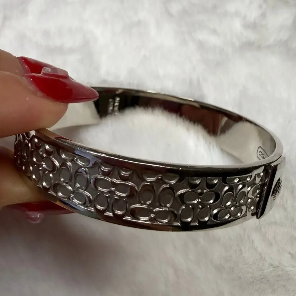 COACH Silver-Tone Quilted C Bangle Bracelet - Picture 6 of 7